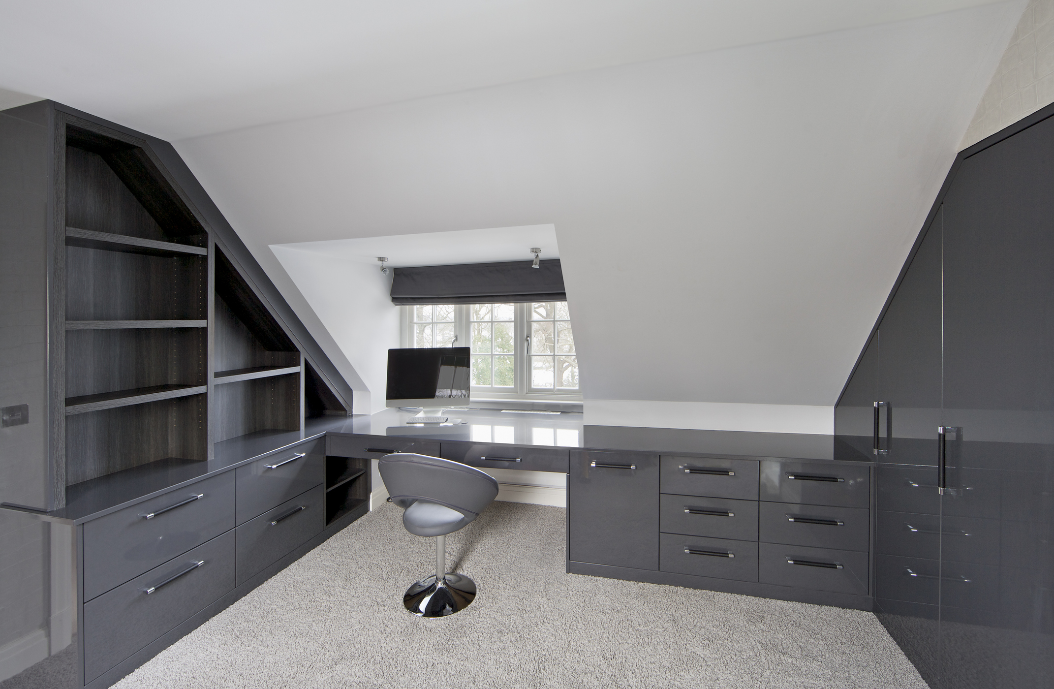 "a bespoke created home office with nicely fitted dark grey shelving, drawers and cupboards. A single operators chair and computer screen have been left to furnish the scene. Looking for a Living Room image Then please see my other Living Room and related images by clicking on the Lightbox link below..."